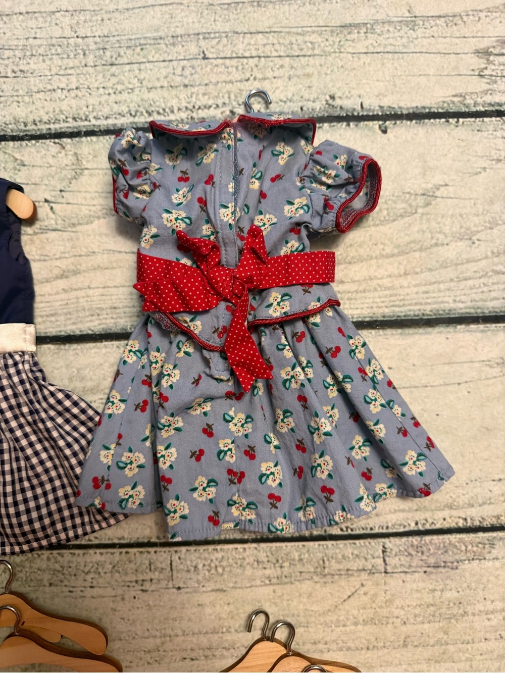 2 American girl doll dresses and 10 wood doll hangers. - Picture 4 of 10